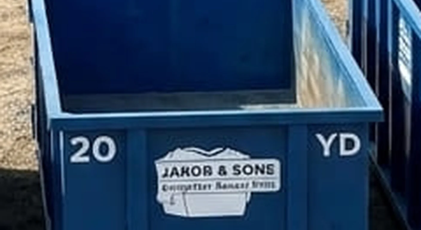 A 20 yard Jakob & Sons Dumpster Rental roll-off dumpster staged for a job in Genesee Township, MI